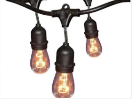 Close-up of premium outdoor patio lighting featuring warm Edison-style string lights with durable, weather-resistant sockets. These commercial-grade patio lights create a cozy ambiance for patios, decks, pergolas, restaurants, and outdoor living spaces and are professionally installed by Washington Holiday Lighting as part of their custom outdoor lighting services.